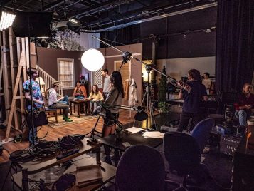 Honors student Seth Andrews conducts a shoot for his production DROPOUTS in studio C 